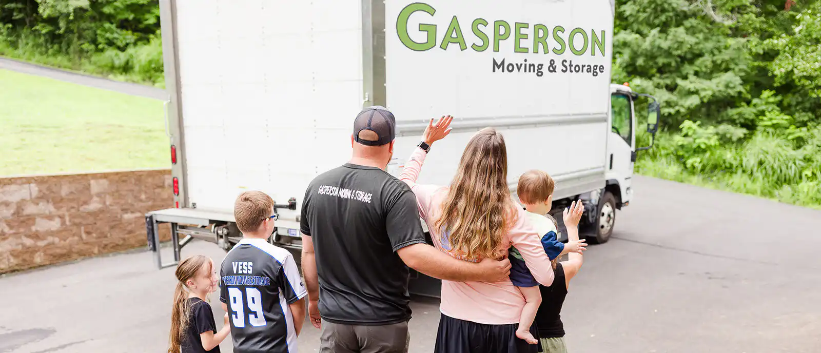 Family waving goodbye to Gasperson Moving & Storage